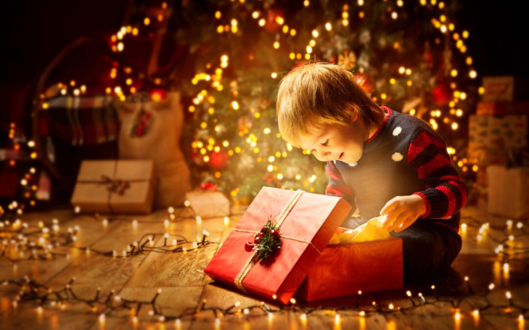 A young boy opening a present